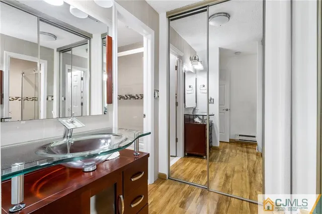 a bathroom with a sink and a mirror