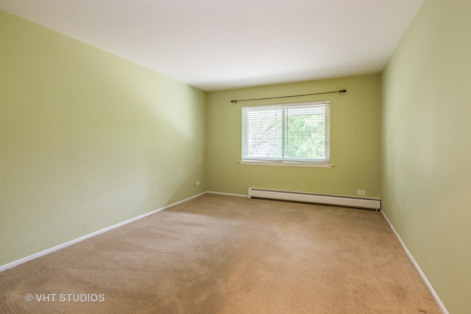 2323 South Goebbert Road, Unit 207 Arlington Heights, IL 60005 - Photo 9 of 12 an empty room with a window