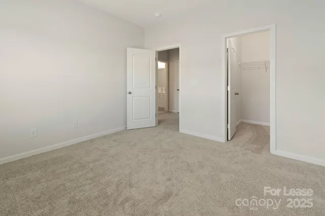 an empty room with closet area