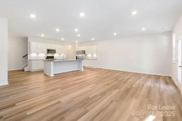 a view of kitchen and wooden floor