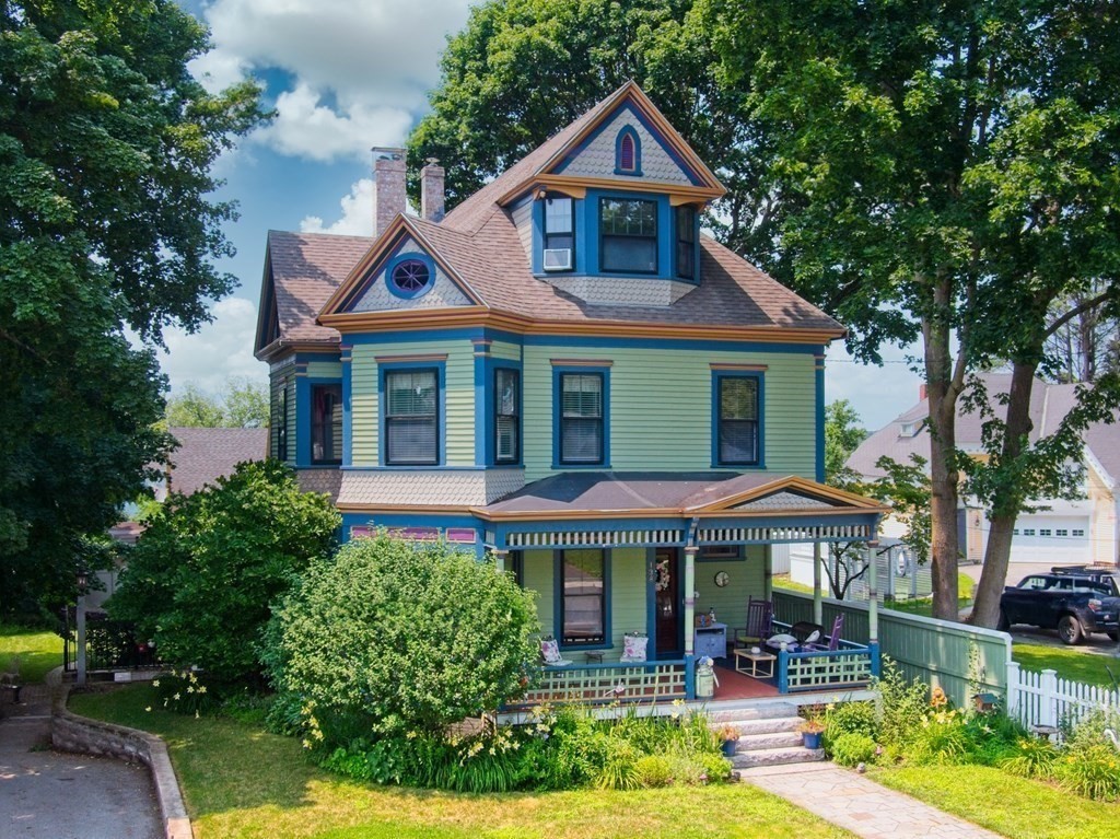 138 Walnut Street Clinton, MA 01510 - Photo 1 of 42 a front view of a house with garden