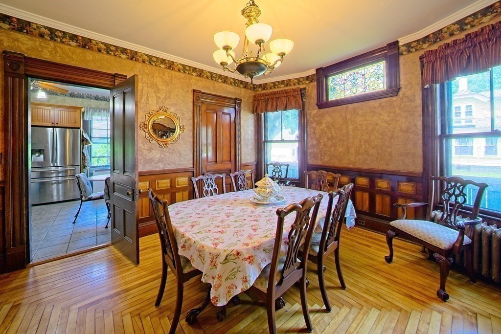 138 Walnut Street Clinton, MA 01510 - Photo 12 of 42 a view of a dining room with furniture window and wooden floor