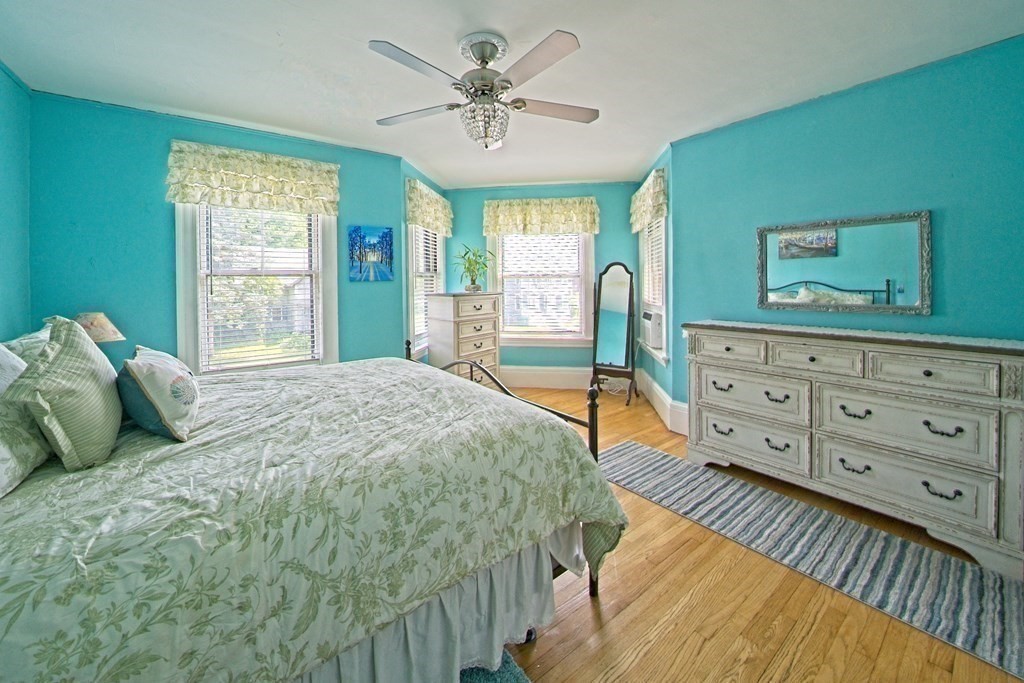138 Walnut Street Clinton, MA 01510 - Photo 19 of 42 a bedroom with a bed a dresser next to a window