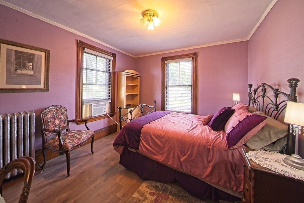 138 Walnut Street Clinton, MA 01510 - Photo 20 of 42 a bedroom with a bed and wooden floor