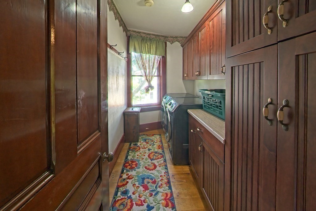 138 Walnut Street Clinton, MA 01510 - Photo 23 of 42 a storage room with wooden floor and furniture