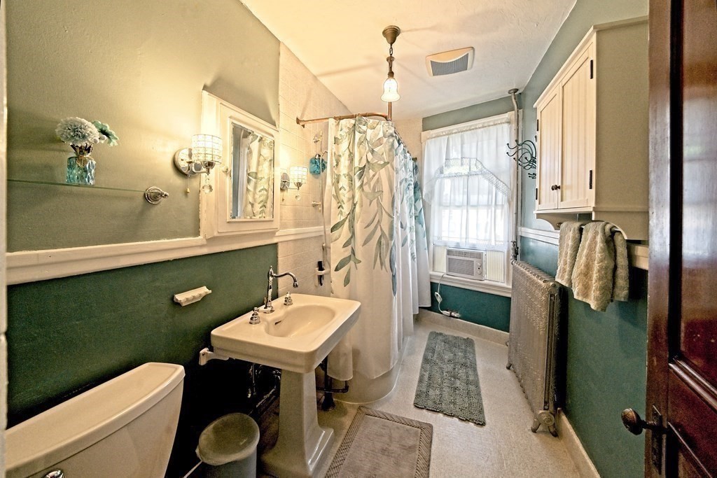 138 Walnut Street Clinton, MA 01510 - Photo 24 of 42 a bathroom with a sink a toilet and mirror