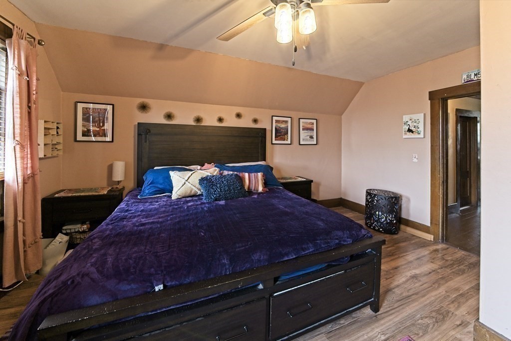 138 Walnut Street Clinton, MA 01510 - Photo 25 of 42 a bed sitting in a bedroom next to a window