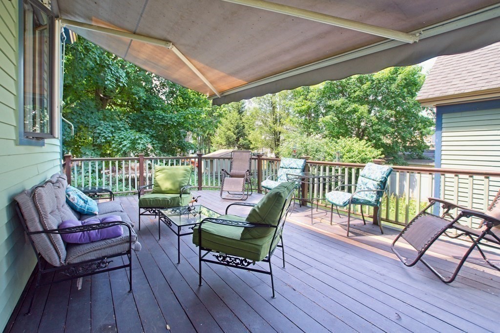 138 Walnut Street Clinton, MA 01510 - Photo 31 of 42 a view of a chair and table on the deck