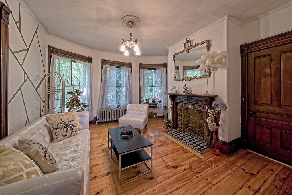 138 Walnut Street Clinton, MA 01510 - Photo 9 of 42 a living room with furniture or couch and a fireplace
