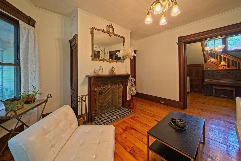 138 Walnut Street Clinton, MA 01510 - Photo 10 of 42 a bedroom with furniture and a fireplace