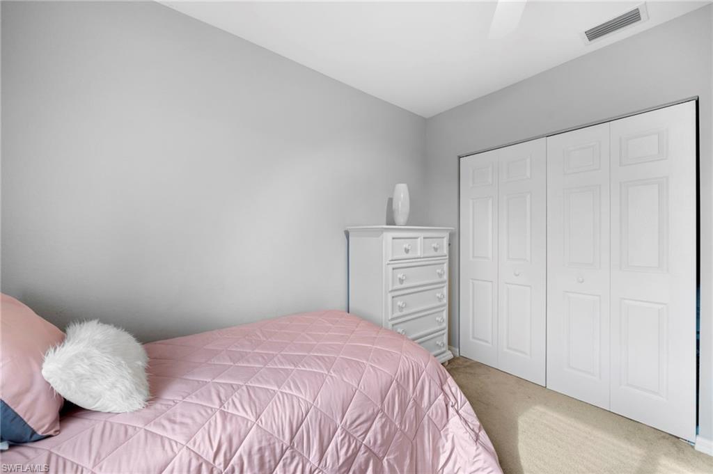 17567 Brickstone Loop Fort Myers, FL 33967 - Photo 20 of 27 a bedroom with a bed and a closet