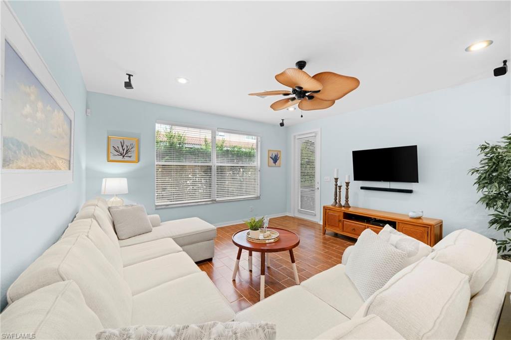 17567 Brickstone Loop Fort Myers, FL 33967 - Photo 4 of 27 a living room with furniture and a flat screen tv