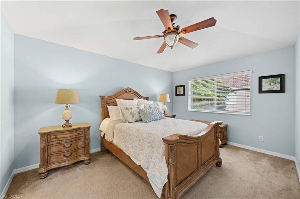 17567 Brickstone Loop Fort Myers, FL 33967 - Photo 10 of 27 a bedroom with a bed and a window