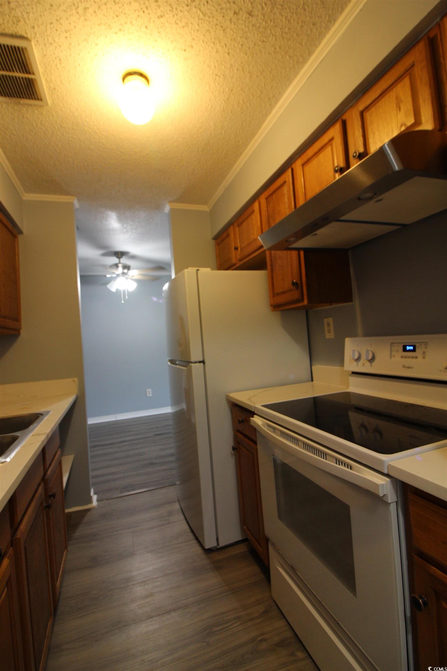 950 Forestbrook Road, Unit B8 Myrtle Beach, SC 29579 - Photo 15 of 27 Kitchen featuring electric stove, a textured ceili