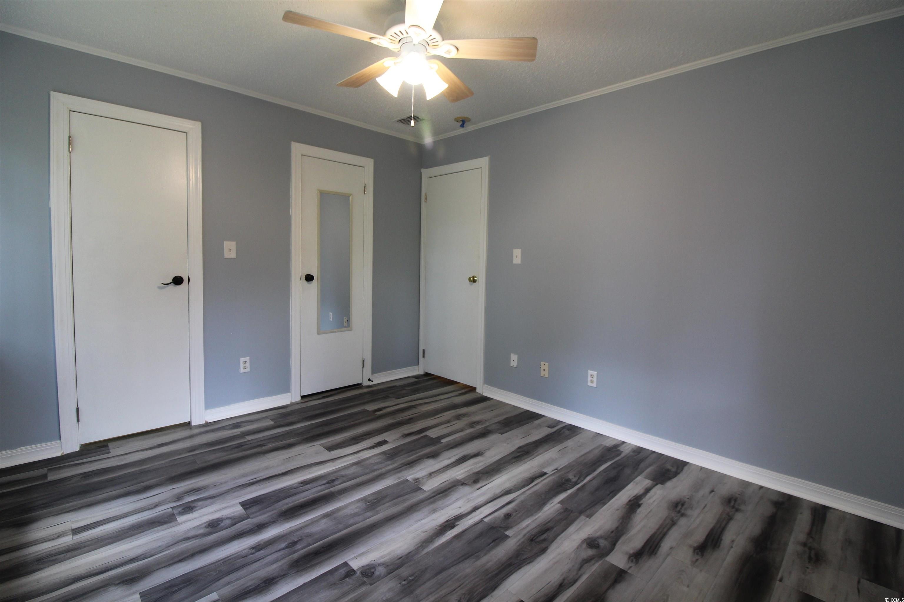 950 Forestbrook Road, Unit B8 Myrtle Beach, SC 29579 - Photo 9 of 27 Unfurnished bedroom with dark wood-type flooring,