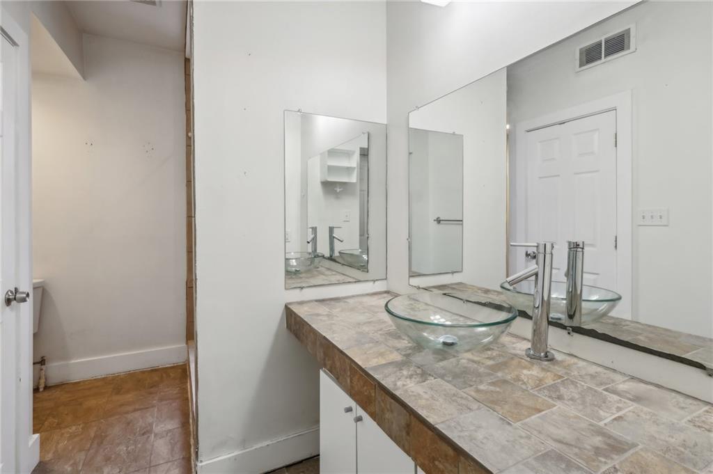 176 Lodi Way Pittsburgh, PA 15201 - Photo 13 of 28 a bathroom with a granite countertop sink and a mirror