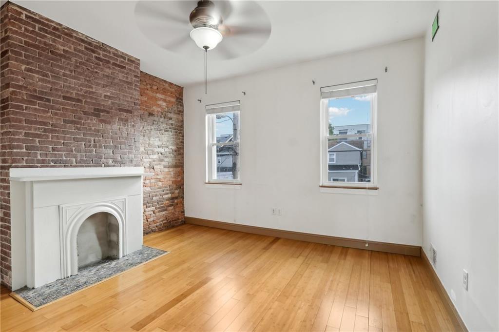 176 Lodi Way Pittsburgh, PA 15201 - Photo 17 of 28 a view of empty room with window and fireplace