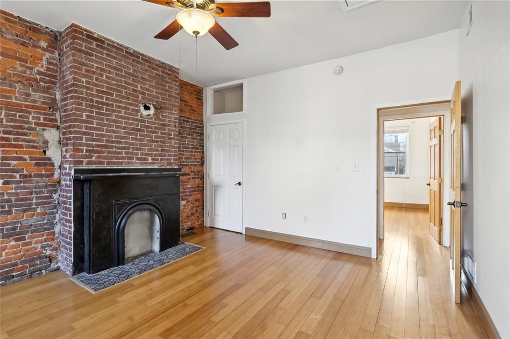 176 Lodi Way Pittsburgh, PA 15201 - Photo 20 of 28 a view of an empty room with wooden floor