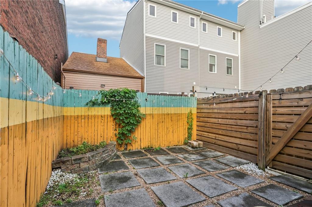 176 Lodi Way Pittsburgh, PA 15201 - Photo 22 of 28 a front view of a house with a garden