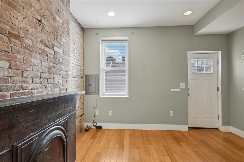 176 Lodi Way Pittsburgh, PA 15201 - Photo 6 of 28 a view of an empty room with a fireplace and a window
