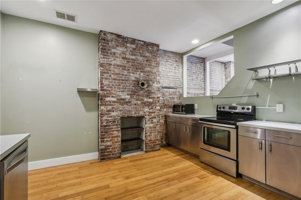176 Lodi Way Pittsburgh, PA 15201 - Photo 9 of 28 a kitchen with stainless steel appliances granite countertop a stove and a sink
