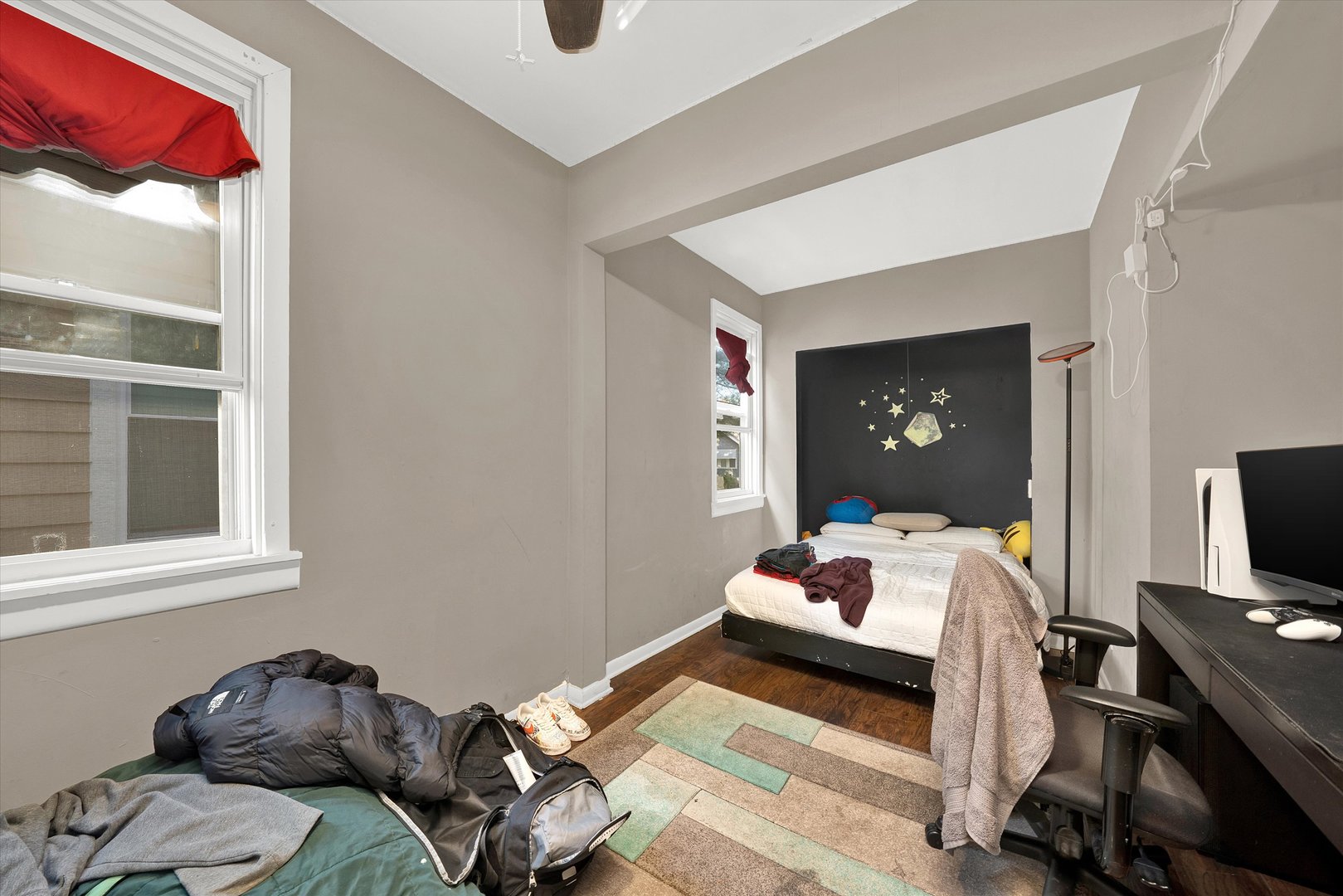331 West 107th Street Chicago, IL 60628 - Photo 12 of 28 a bedroom with a bed and wooden floor