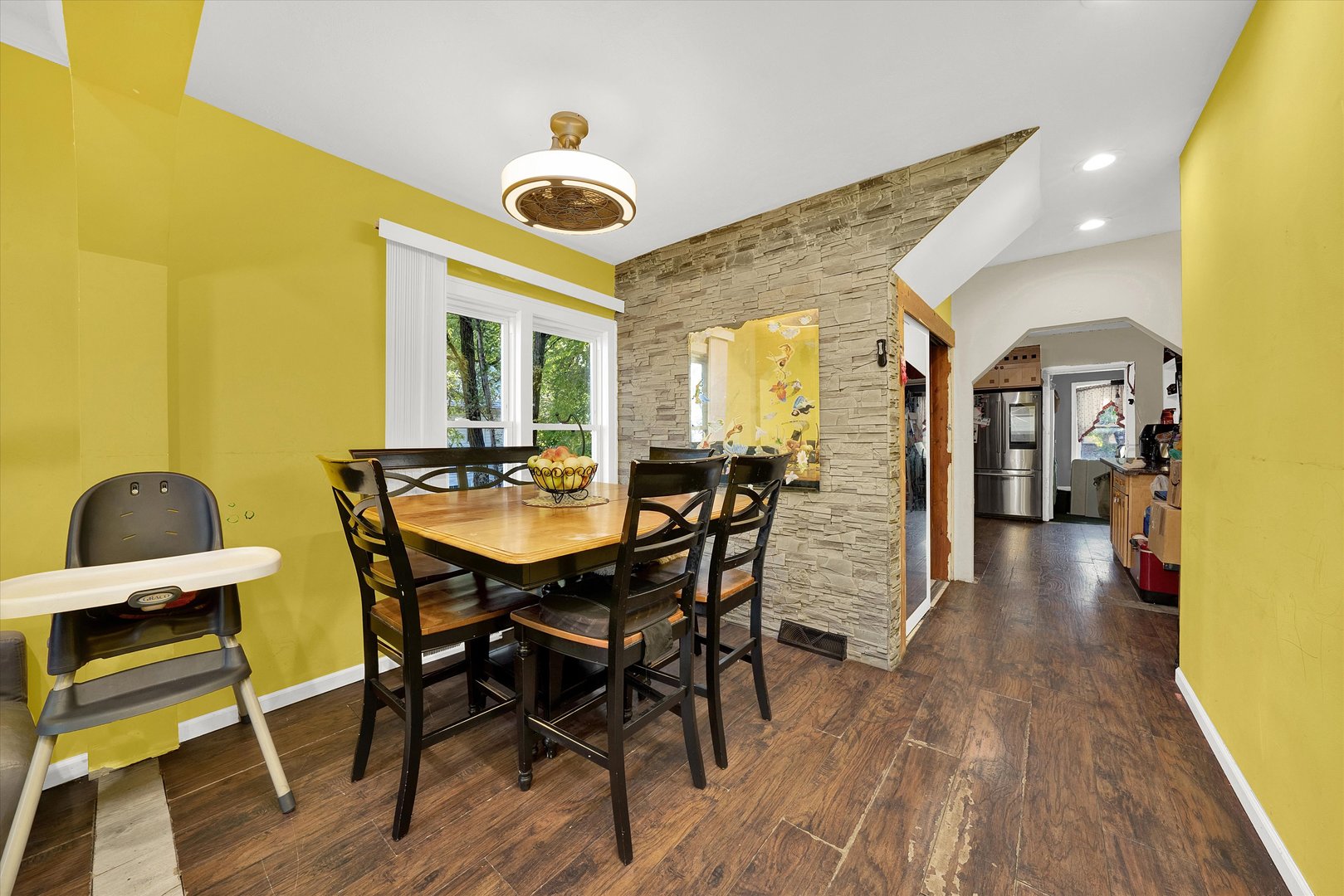331 West 107th Street Chicago, IL 60628 - Photo 5 of 28 a view of a dining room with furniture and wooden floor
