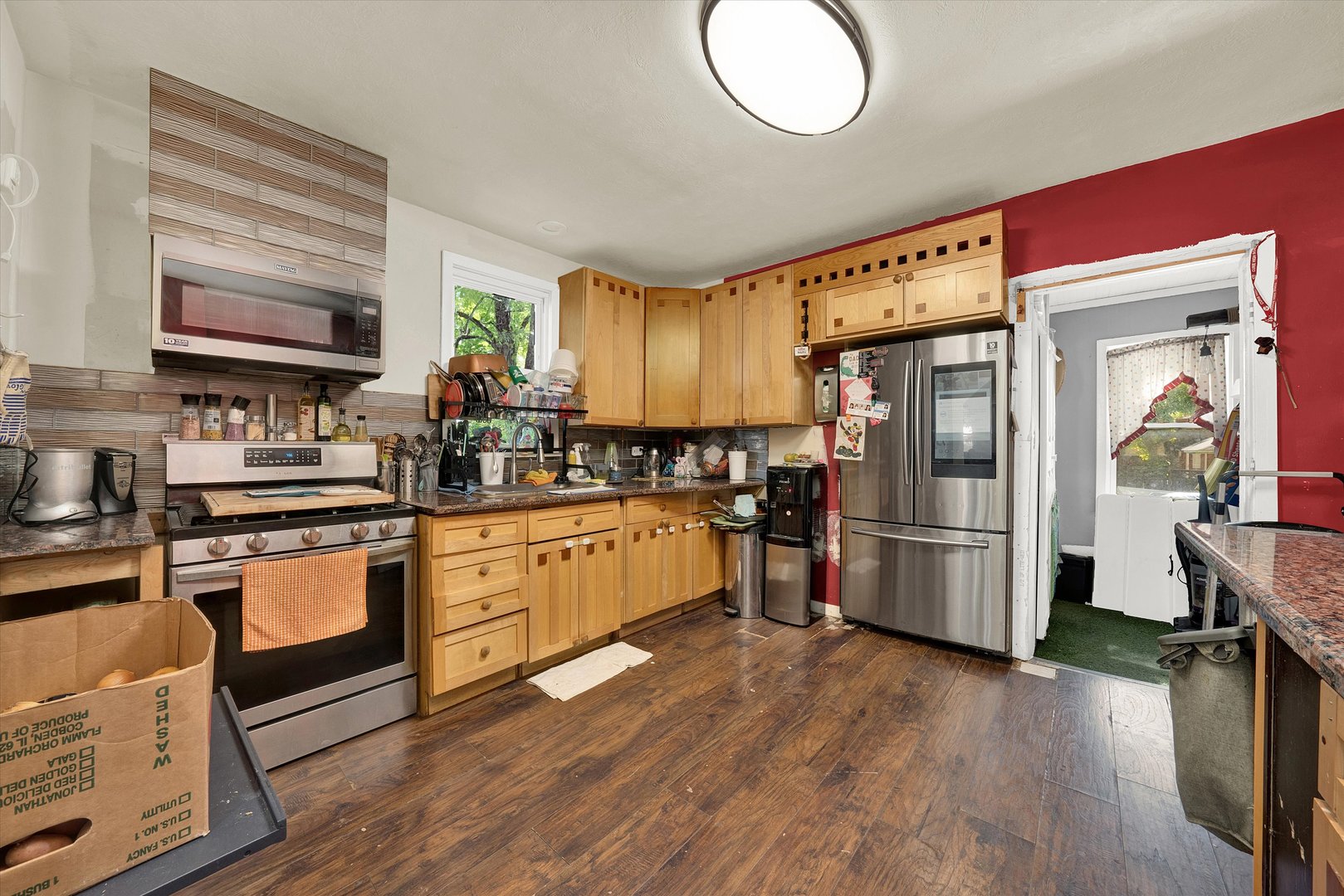 331 West 107th Street Chicago, IL 60628 - Photo 7 of 28 a kitchen with refrigerator cabinets and wooden floor