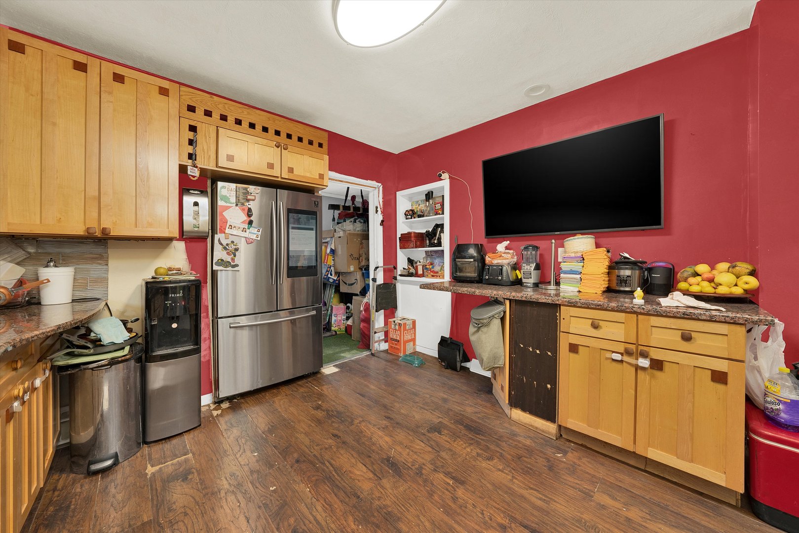 331 West 107th Street Chicago, IL 60628 - Photo 9 of 28 a kitchen with stainless steel appliances a stove a refrigerator and a microwave