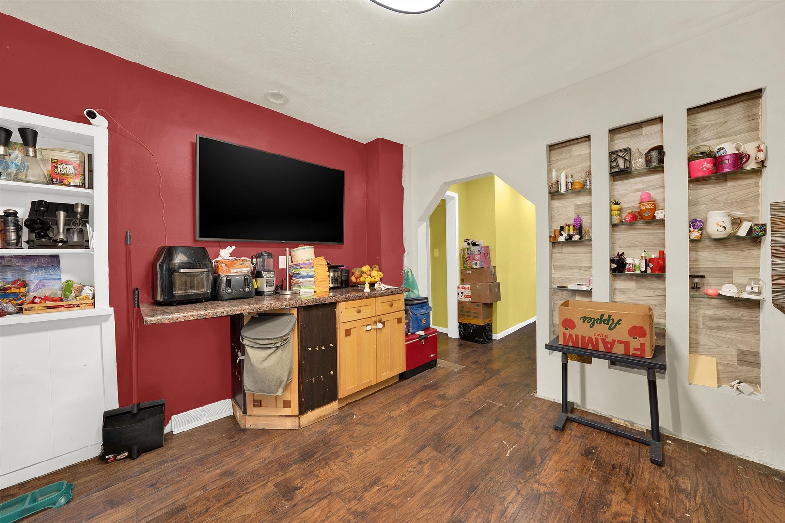 331 West 107th Street Chicago, IL 60628 - Photo 10 of 28 a room with furniture and a flat screen tv