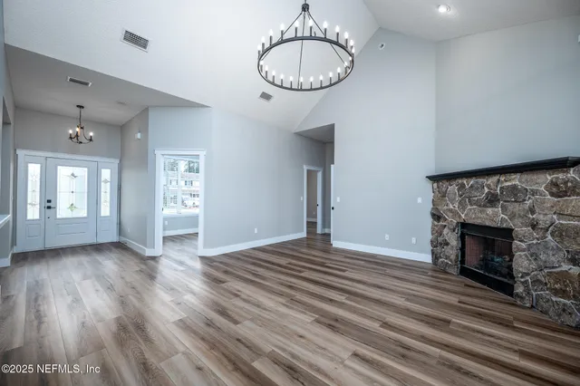 a kitchen with stainless steel appliances granite countertop a sink stove and microwave