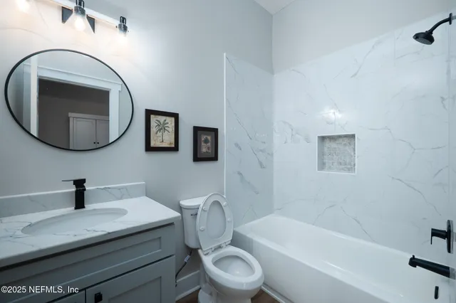 a view of a livingroom with wooden floor