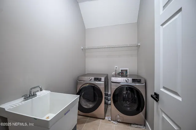 a view of a house with backyard and porch