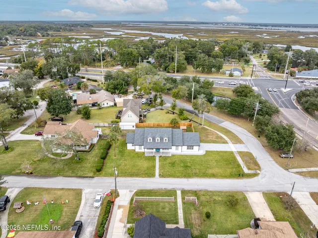 a view of a swimming pool with a lawn chairs