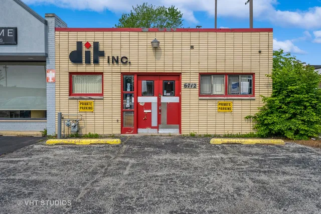 a view of a house with wooden fence