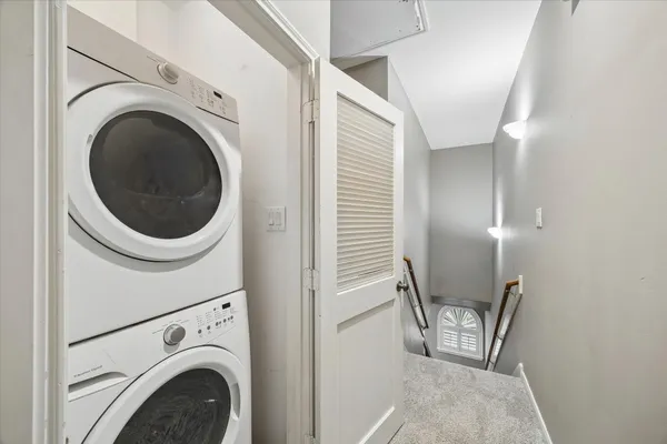 a view of a hallway with washer and dryer