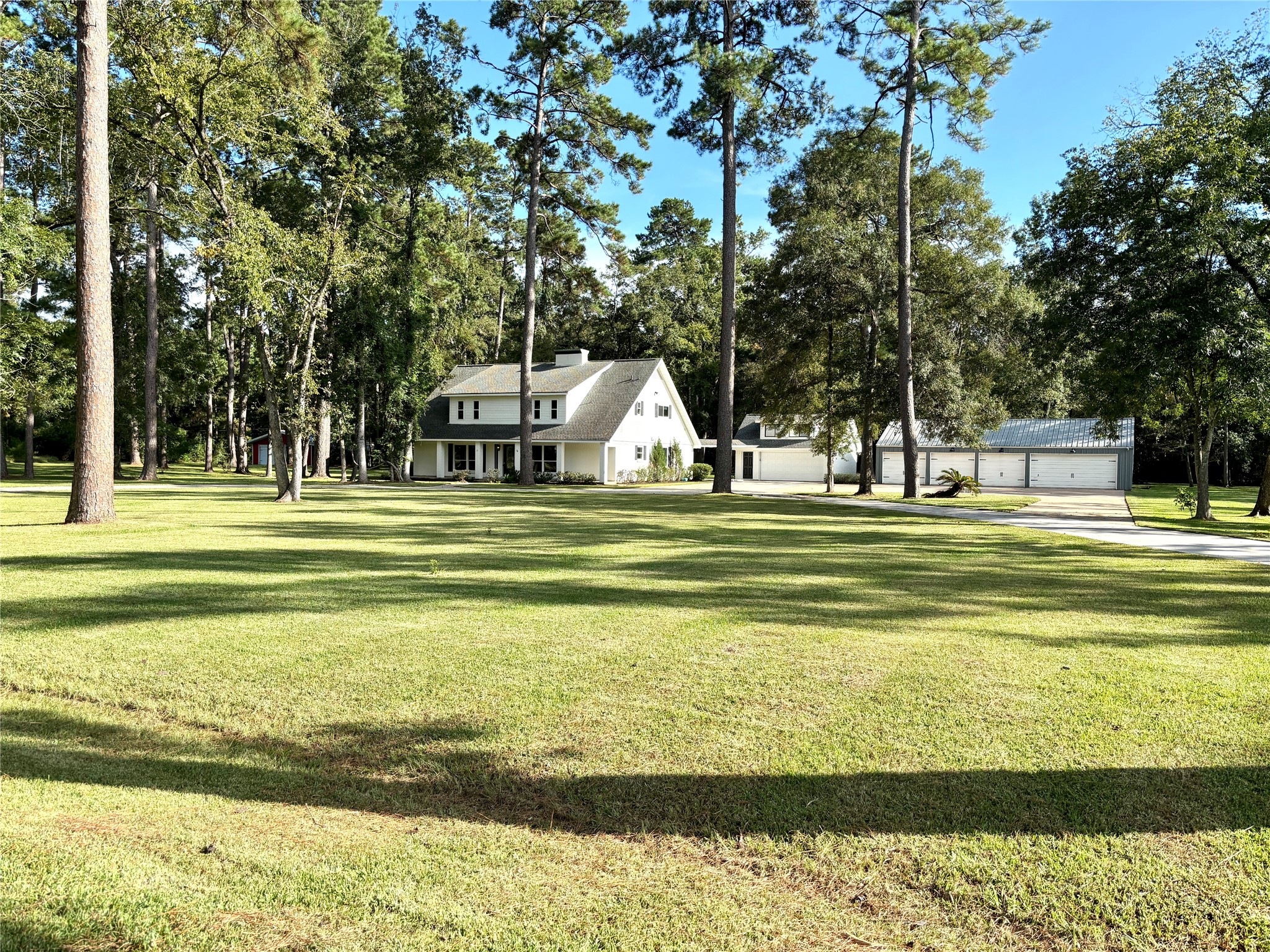 Welcome to this One-of-a-kind home sitting on 4 lush acres with warehouse, barn, garage and nature preserve in the back.