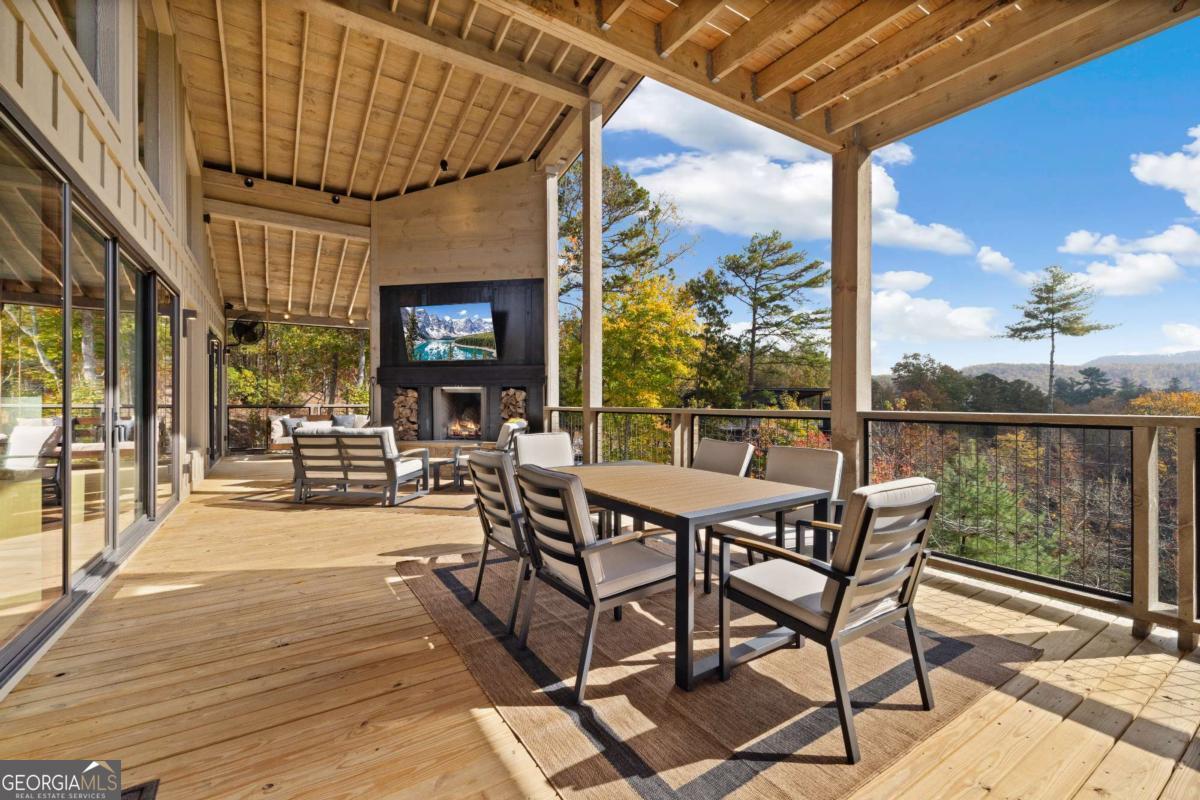 142 Sequoia Ridge Blue Ridge, GA 30513 - Photo 13 of 45 a view of a patio with a table and chairs