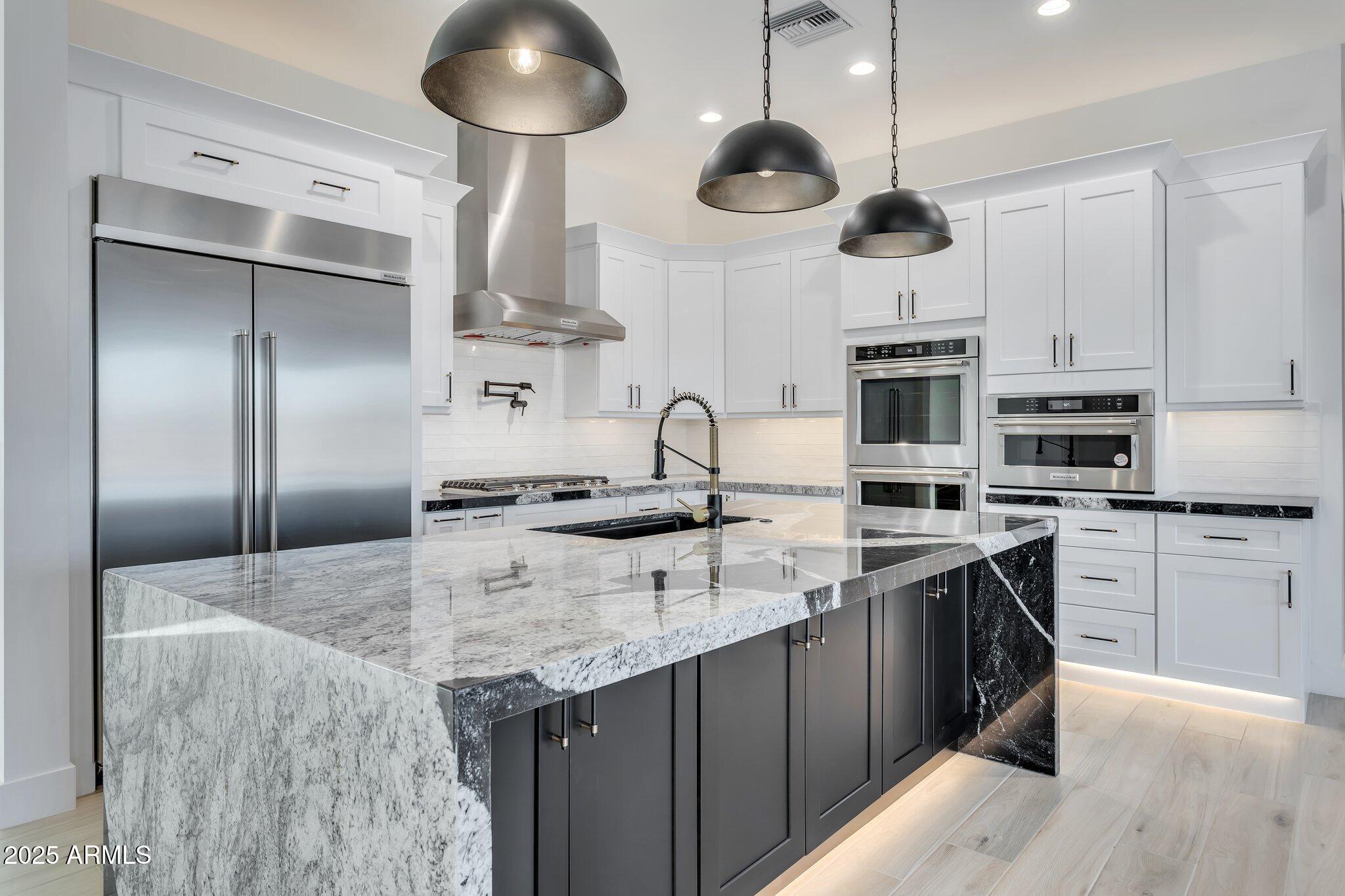 1602 East Cloud Road Phoenix, AZ 85086 - Photo 2 of 45 a kitchen with stainless steel appliances granite countertop a sink a stove and a refrigerator
