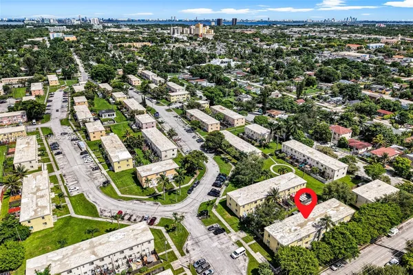 an aerial view of residential houses with outdoor space