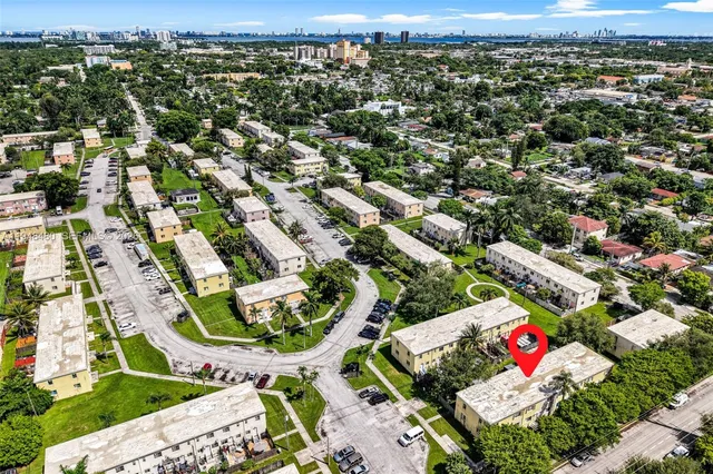 an aerial view of residential houses with outdoor space