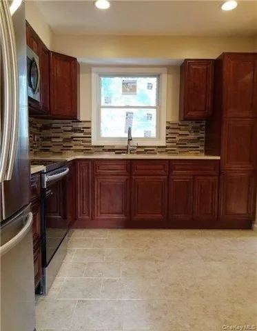 a kitchen with a cabinets and a sink