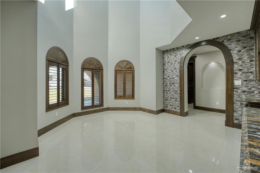 2916 Fletcher Street Weslaco, TX 78599 - Photo 14 of 45 an empty room with windows and mirror