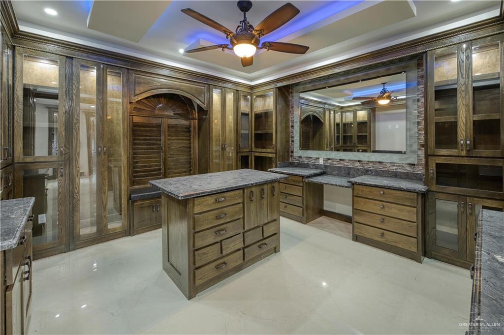 2916 Fletcher Street Weslaco, TX 78599 - Photo 28 of 45 a kitchen with stainless steel appliances granite countertop a stove and cabinets