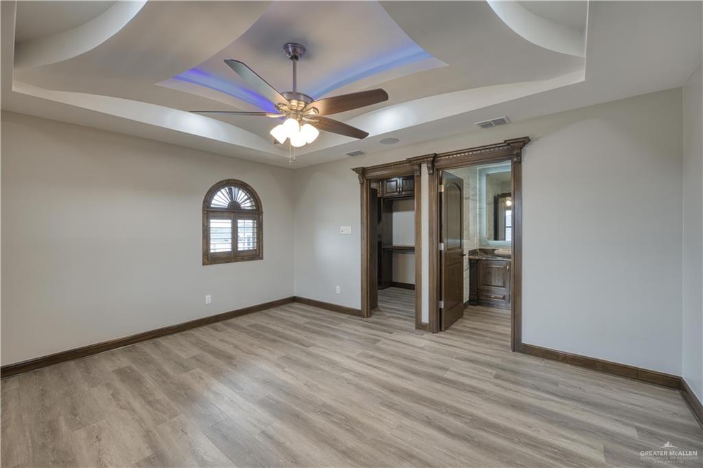 2916 Fletcher Street Weslaco, TX 78599 - Photo 35 of 45 wooden floor in an empty room with a window