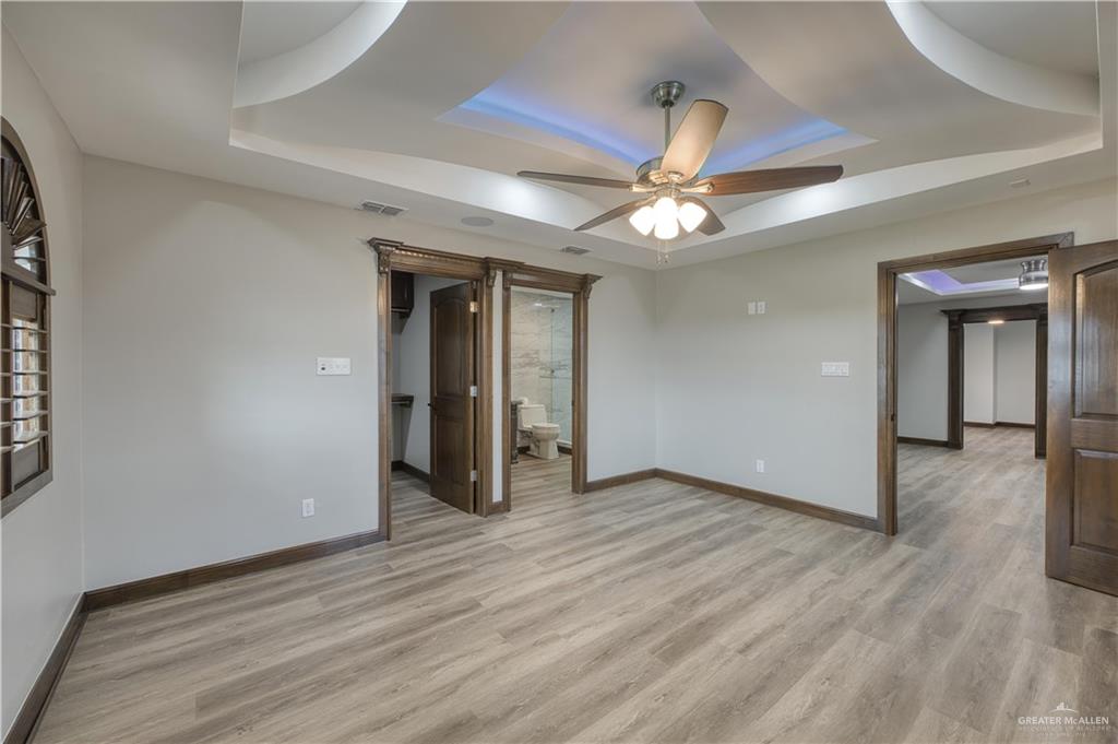 2916 Fletcher Street Weslaco, TX 78599 - Photo 36 of 45 a view of an empty room with a ceiling fan and window