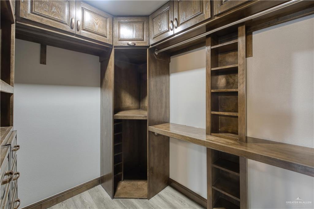 2916 Fletcher Street Weslaco, TX 78599 - Photo 37 of 45 a kitchen with a refrigerator and cabinets