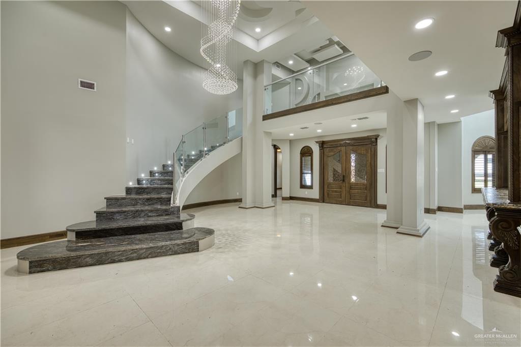 2916 Fletcher Street Weslaco, TX 78599 - Photo 4 of 45 an entryway in a hall with a front door