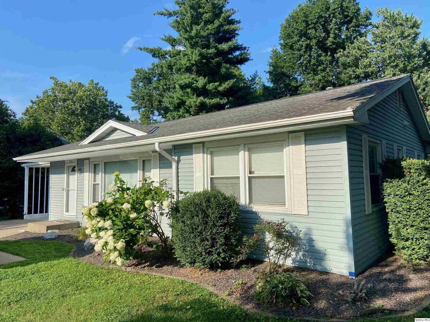 1632 North 24th Street Quincy, IL 62301 - Photo 1 of 36 a front view of a house with a yard