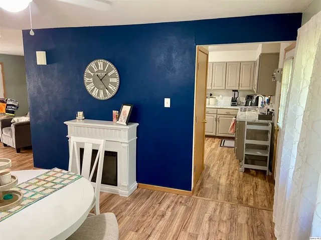 a view of kitchen with sink and refrigerator